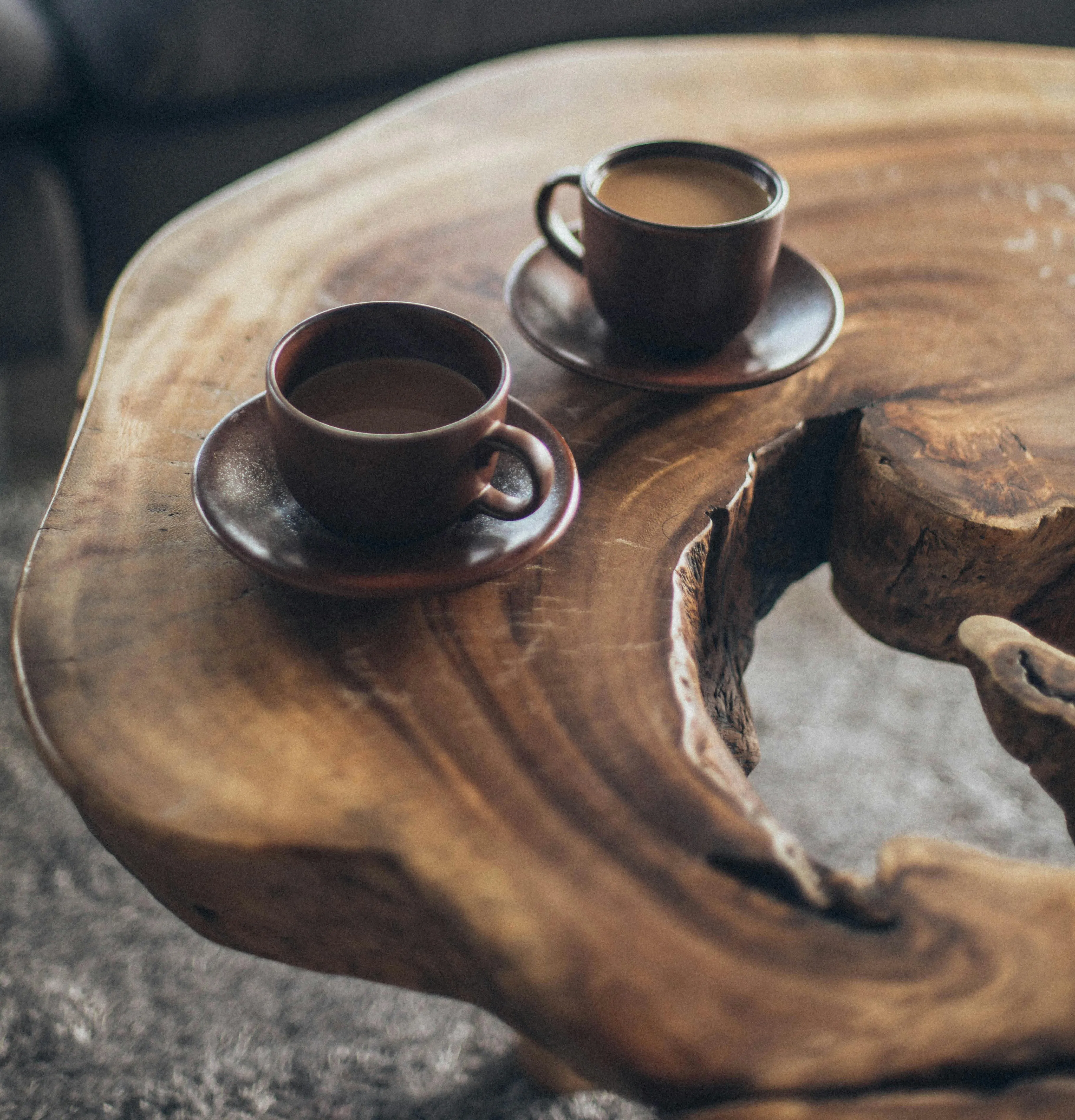 Two coffee mugs on a beautiful wooden table