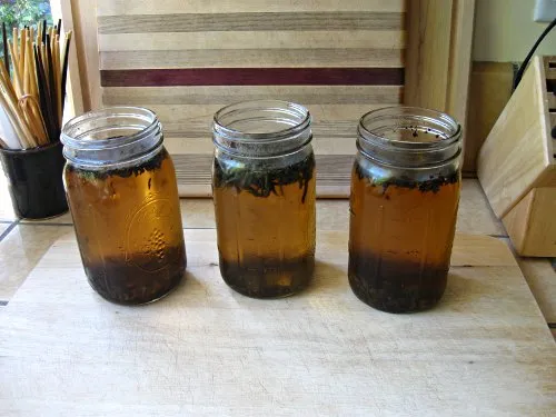 The finished tea in glass jars before the tea leaves are removed